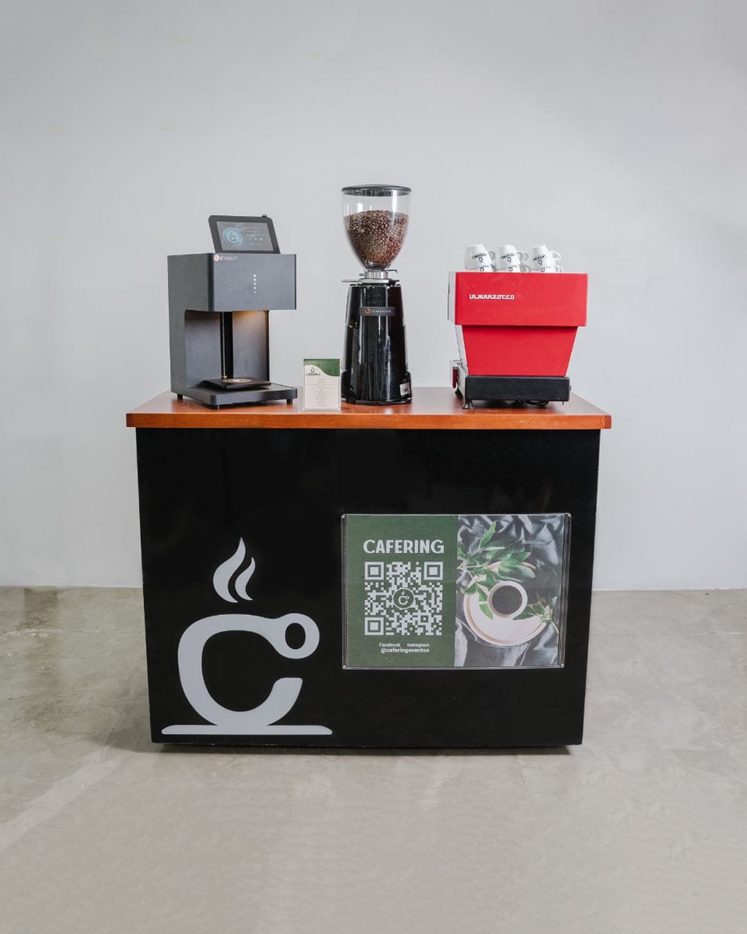 A coffee cart set up with a LaMarzocco, coffee grinder and latte printer, for Cafering