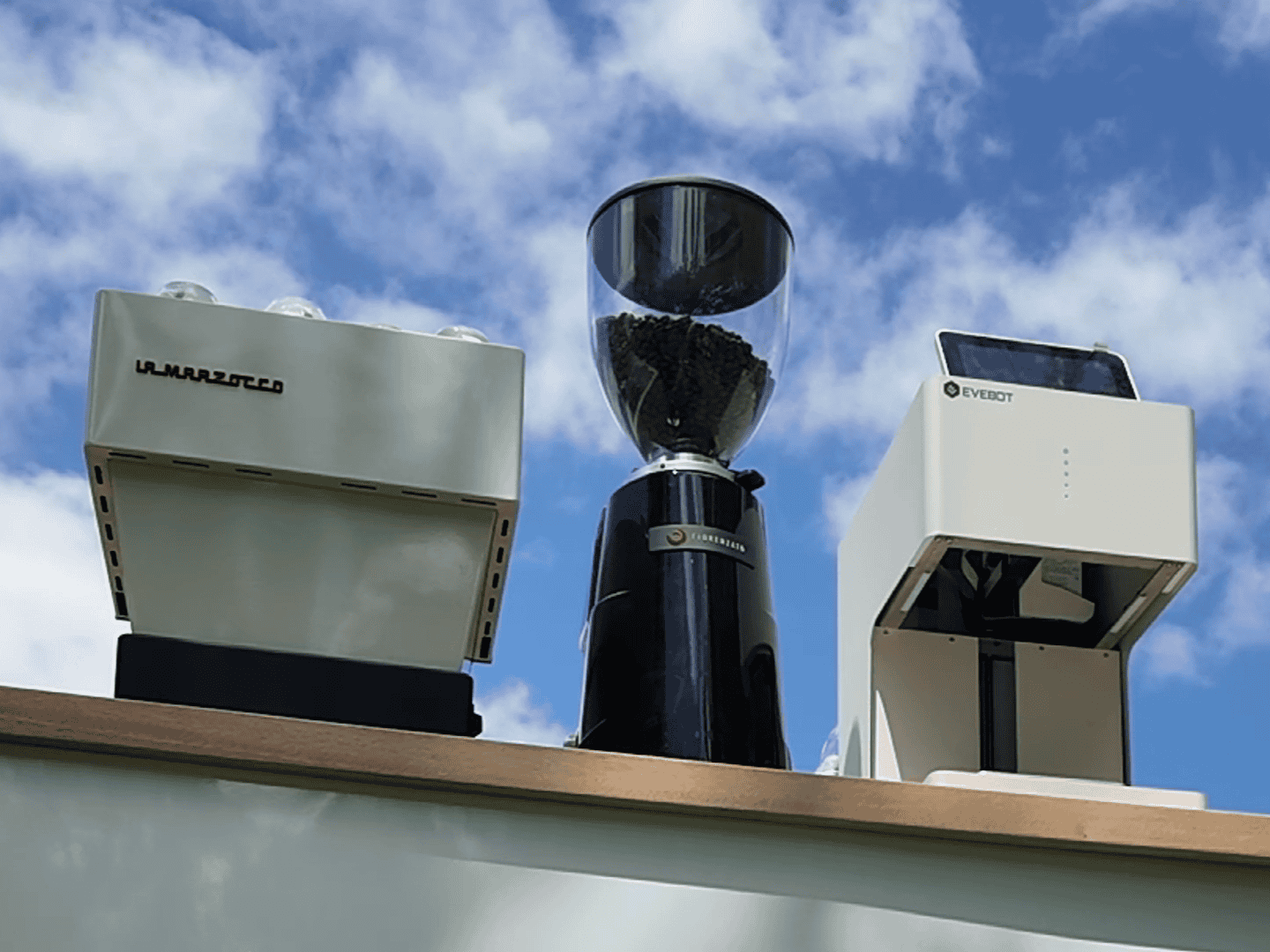 Coffee catering setup in Miami with espresso machine, grinder, and printer for a custom branded event