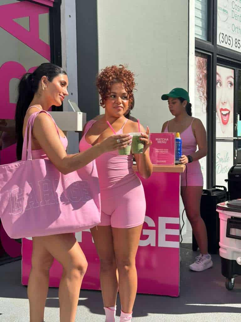 Guests holding branded matcha drinks at a Garage Clothing activation