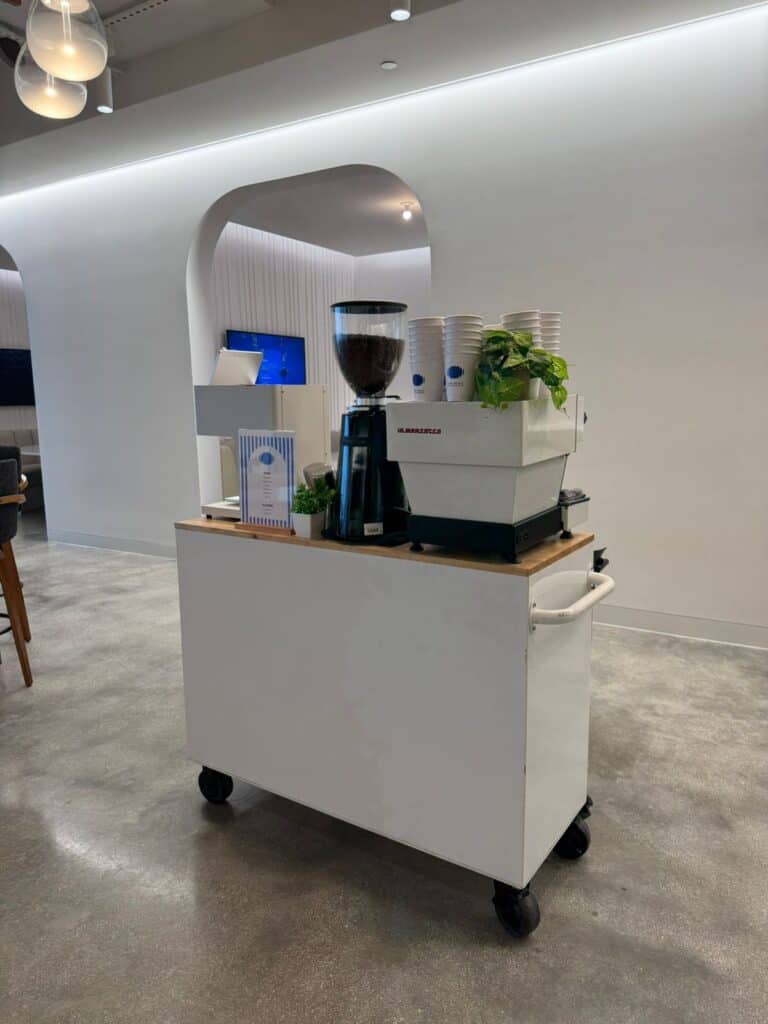 Cafering barista pouring a latte from the coffee cart at a Fort Lauderdale event