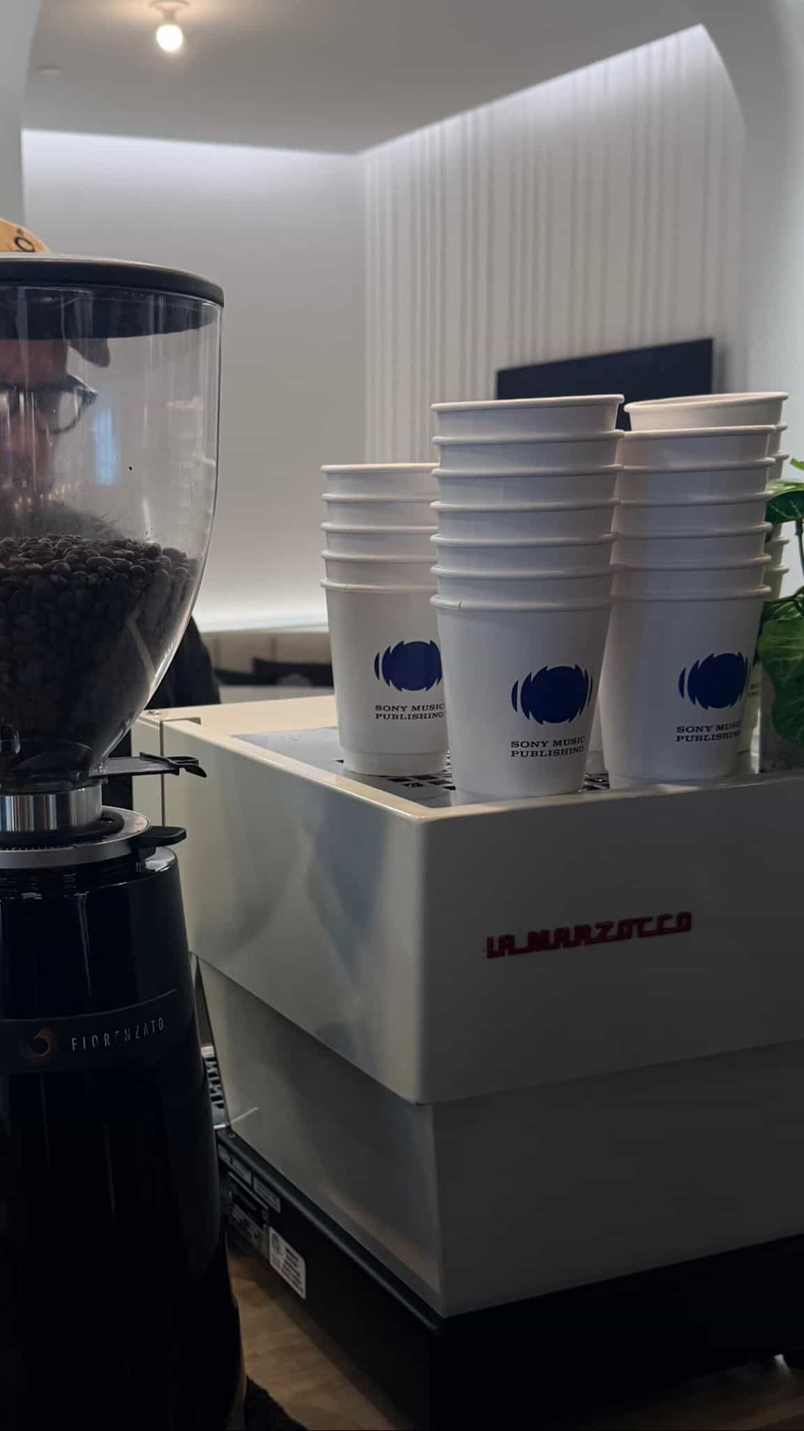 La Marzocco espresso machine with custom branded cups for Miami coffee catering