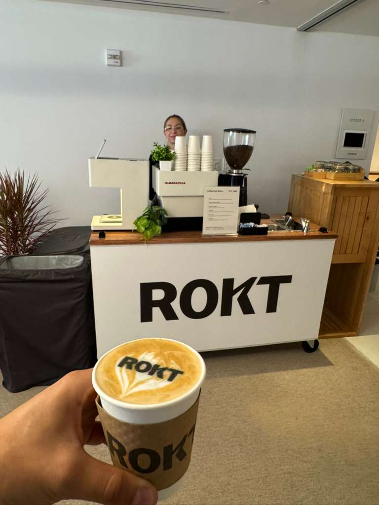 Branded coffee cart with a printed logo and custom cup sleeve