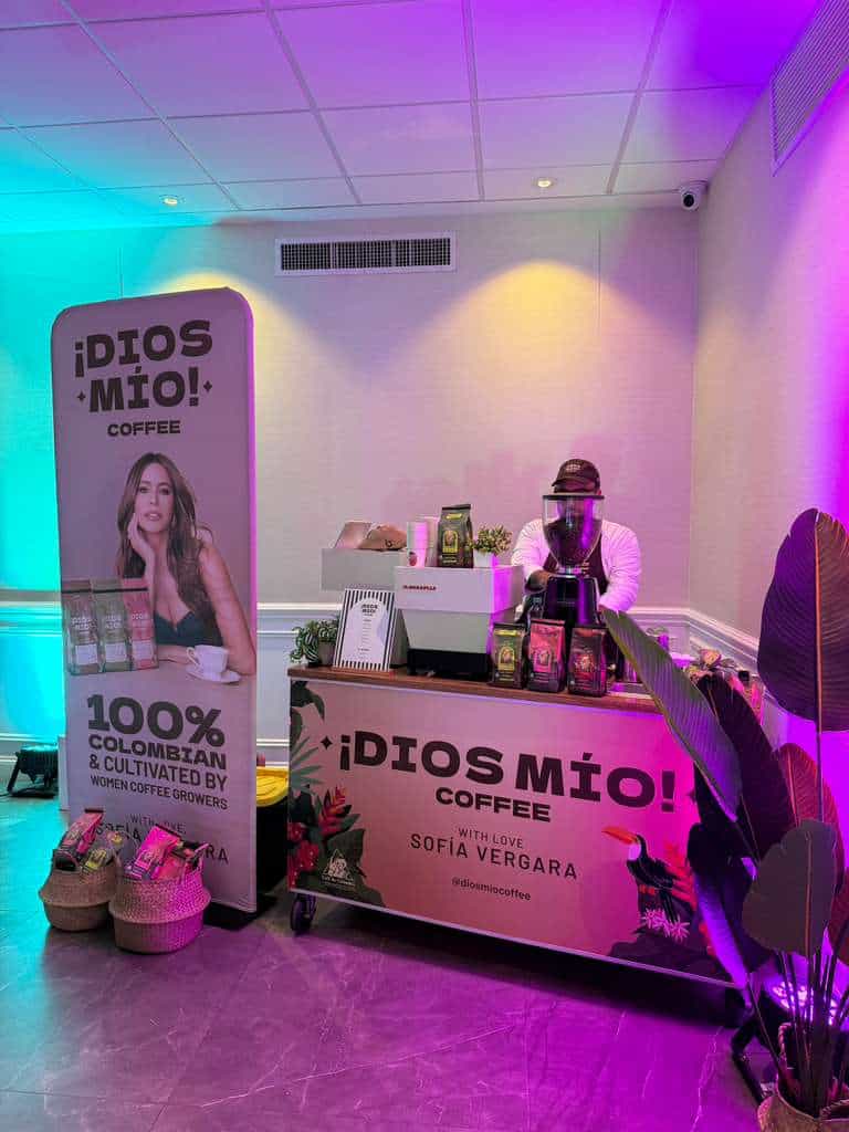 Coffee brand event setup showing branded coffee cart and partner coffee program
