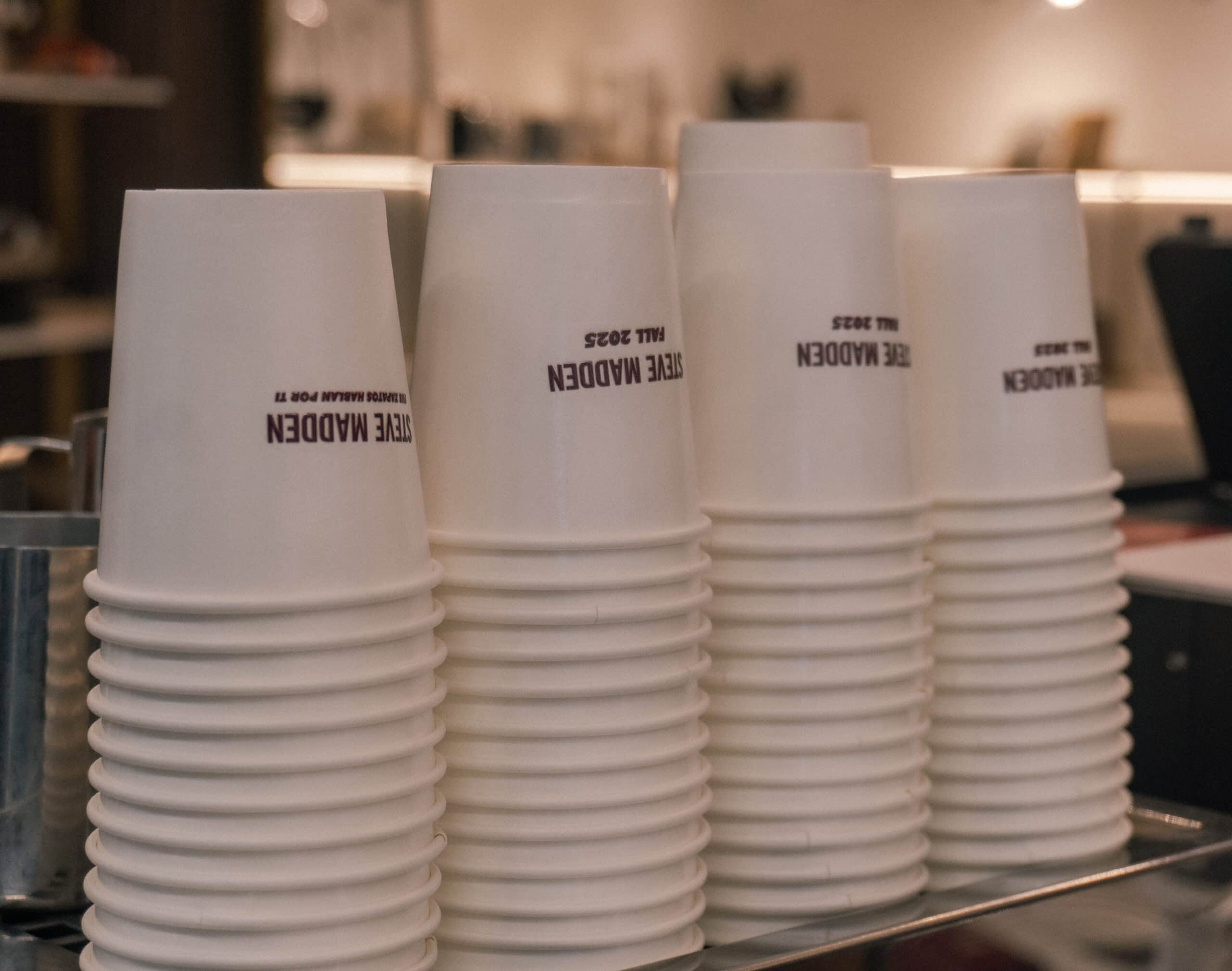 Steve Madden logo printed on coffee cups