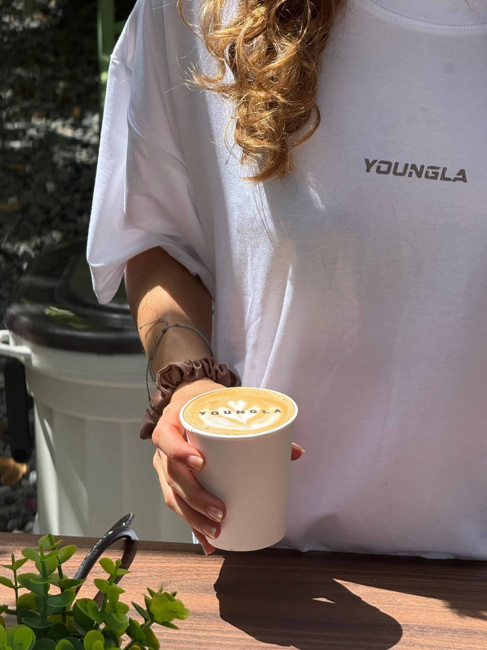 Light blue espresso machine branded for YoungLA