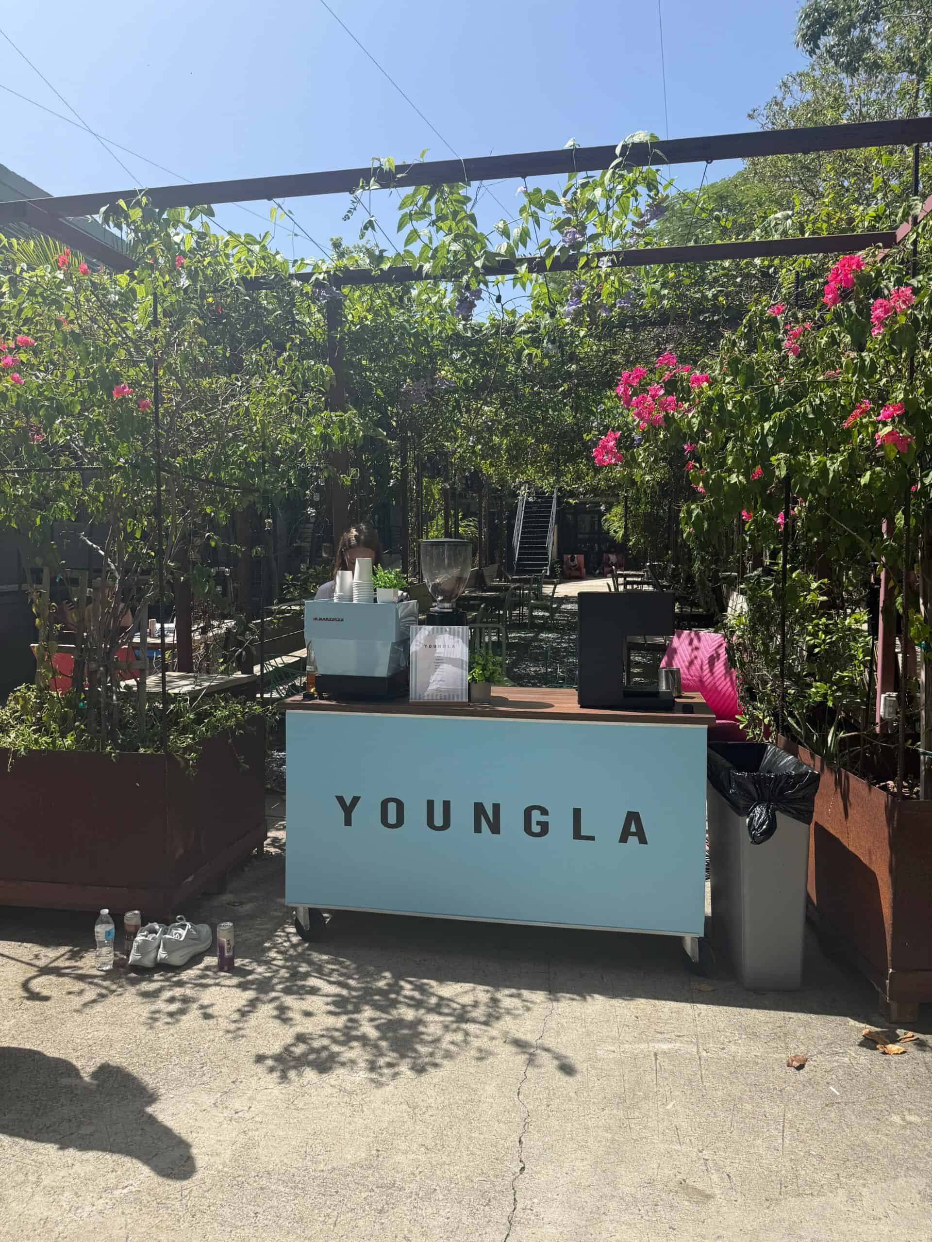 Light baby blue branded coffee cart at a Miami event